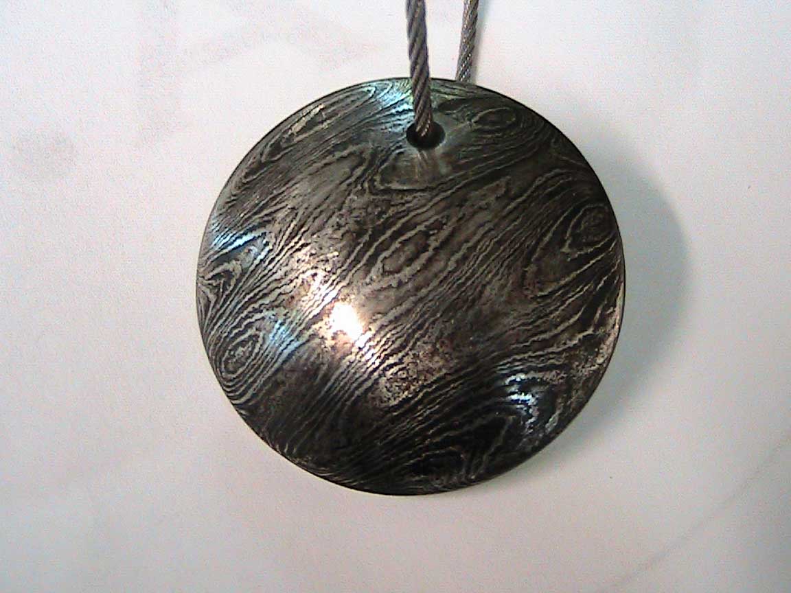 Damascus steel tap